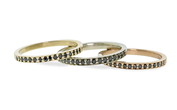 3 wedding bands with 16 black diamonds in 14 karat yellow, white, and rose gold front view on white background