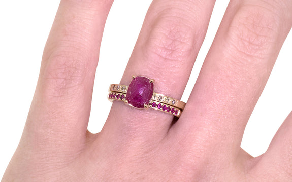 Wedding Band with 16 Rubies worn on model's finger