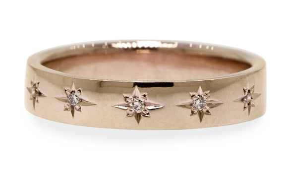 CM Star Wedding Band with Champagne Diamonds modeled on a hand